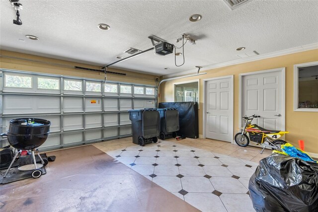 garage featuring visible vents and a garage door opener