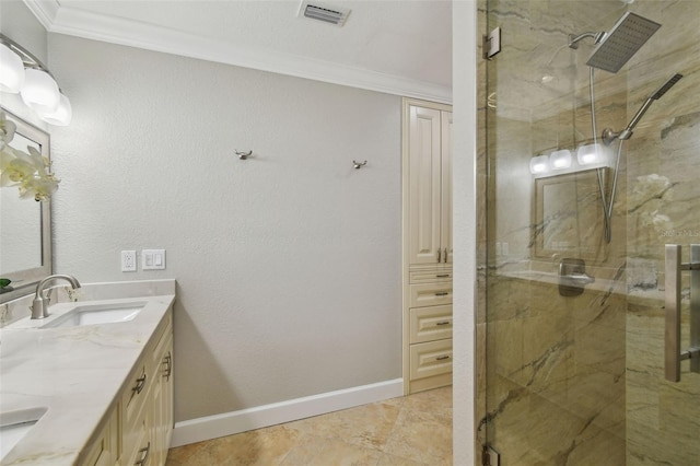 bathroom featuring tile patterned floors, a shower with shower door, vanity, and crown molding