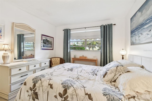 bedroom featuring multiple windows