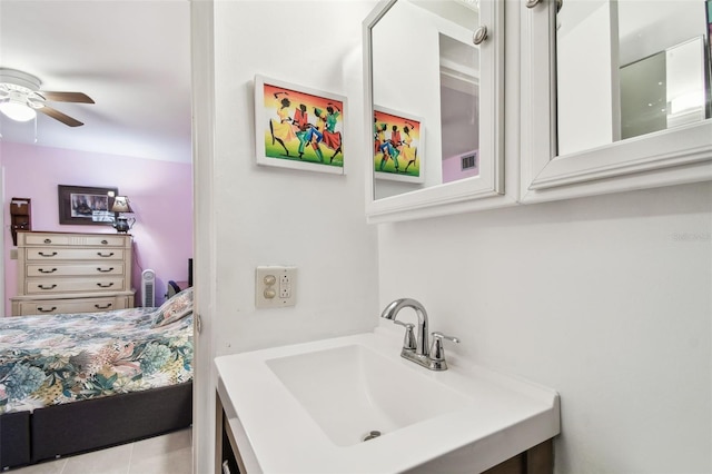 bathroom featuring a ceiling fan, vanity, and tile patterned floors