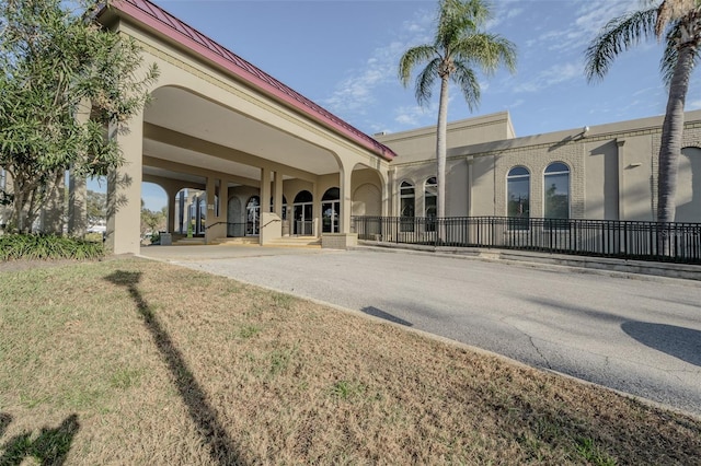 view of building exterior featuring fence