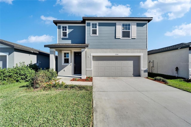 traditional-style house featuring a garage, concrete driveway, a front lawn, and stucco siding