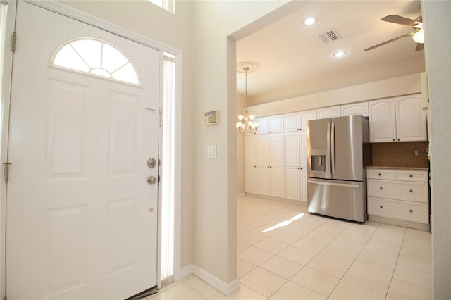 foyer featuring baseboards, visible vents, ceiling fan with notable chandelier, light tile patterned flooring, and recessed lighting