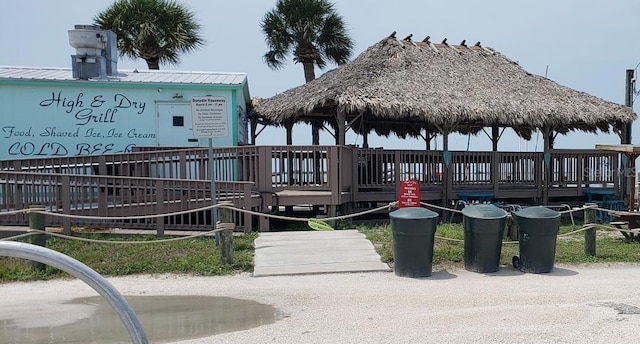 view of property's community with a deck and a gazebo