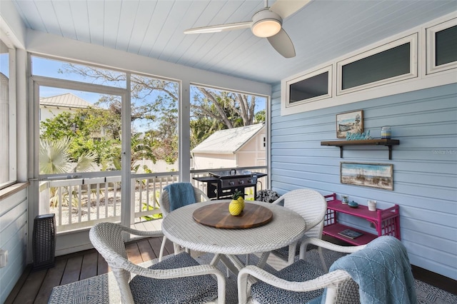 sunroom featuring a wealth of natural light and a ceiling fan