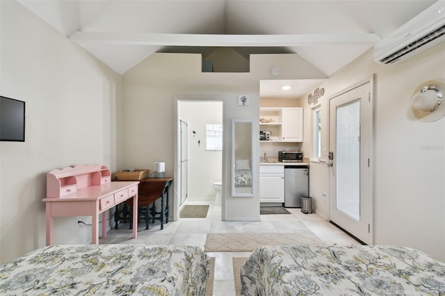 bedroom with an AC wall unit, lofted ceiling with beams, baseboards, and connected bathroom