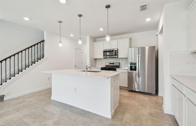 10356 Cross River Trl, Parrish, FL 34219 - kitchen with appliances with stainless steel finishes, a sink, backsplash, recessed lighting, and light countertops
