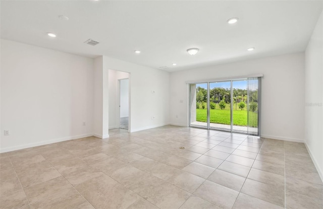 10356 Cross River Trl, Parrish, FL 34219 - spare room featuring recessed lighting, light tile patterned floors, and baseboards