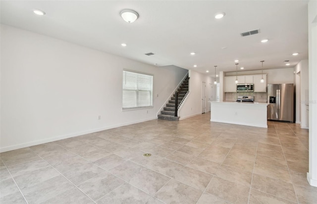 10356 Cross River Trl, Parrish, FL 34219 - unfurnished living room with light tile patterned floors, stairway, recessed lighting, and baseboards