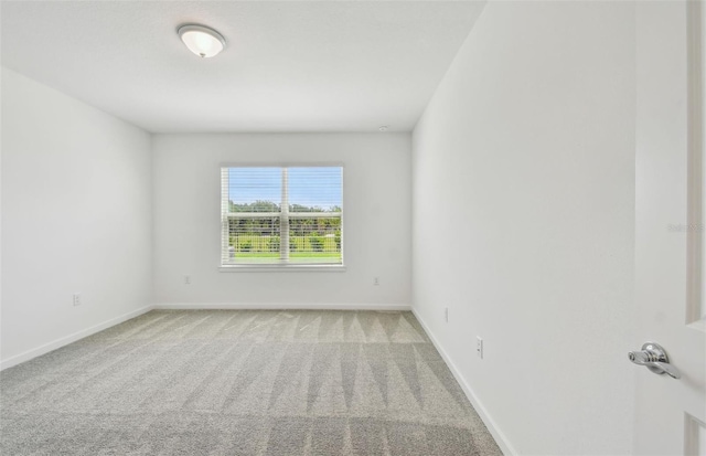 10356 Cross River Trl, Parrish, FL 34219 - spare room with baseboards and light colored carpet