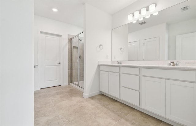 10356 Cross River Trl, Parrish, FL 34219 - bathroom featuring double vanity, a stall shower, and tile patterned floors