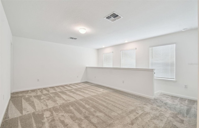 10356 Cross River Trl, Parrish, FL 34219 - spare room featuring carpet flooring and baseboards