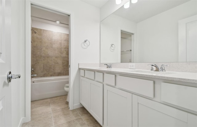 10356 Cross River Trl, Parrish, FL 34219 - bathroom with double vanity, toilet, tile patterned flooring, shower / washtub combination, and baseboards