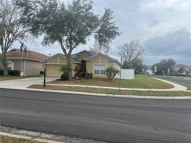 ranch-style house with a garage and a front yard