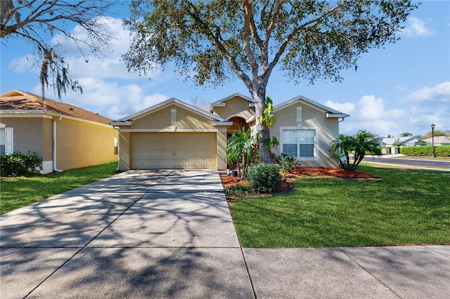 ranch-style house featuring a garage, driveway, a front lawn, and stucco siding