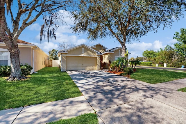 single story home featuring stucco siding, concrete driveway, an attached garage, fence, and a front lawn