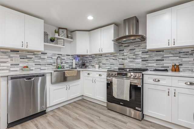 kitchen with appliances with stainless steel finishes, light countertops, open shelves, white cabinetry, and range hood