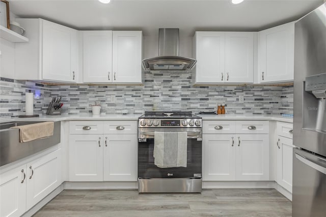 kitchen featuring light countertops, appliances with stainless steel finishes, range hood, white cabinetry, and open shelves