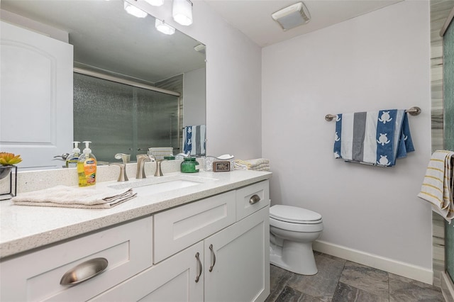 full bath featuring a shower stall, toilet, vanity, and baseboards