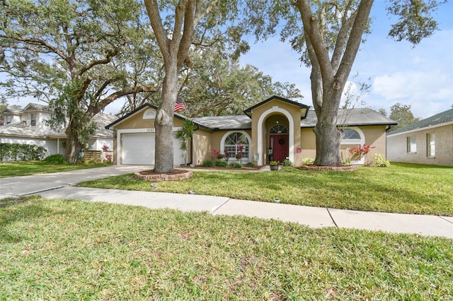 ranch-style house with a garage and a front yard