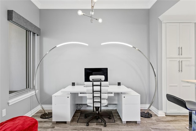 office featuring baseboards, light wood finished floors, and crown molding