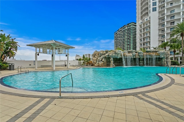 community pool featuring a patio and a gazebo