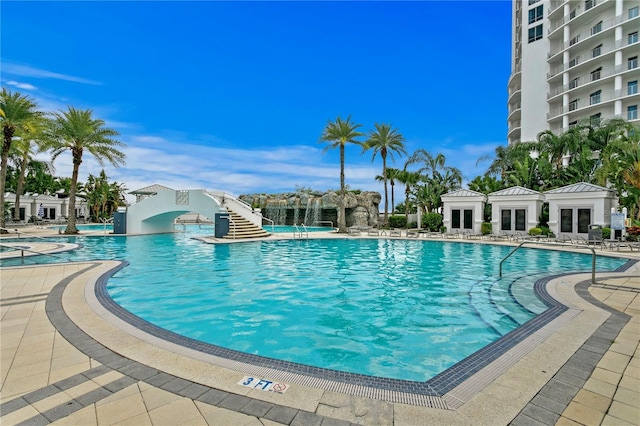 community pool featuring french doors and a patio