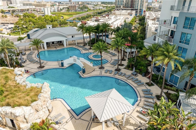 community pool featuring a patio and a city view