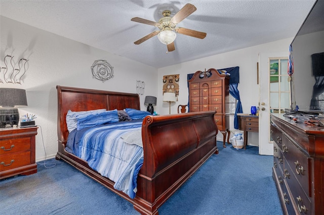 carpeted bedroom with ceiling fan and a textured ceiling