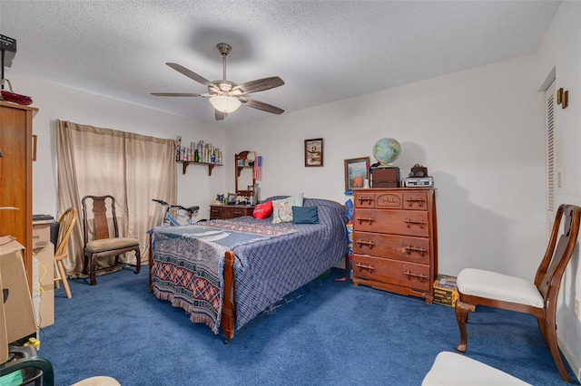 carpeted bedroom featuring a textured ceiling and a ceiling fan