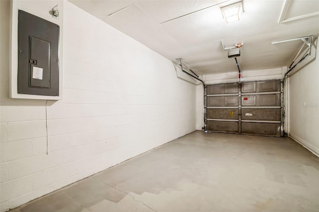 garage with electric panel and a garage door opener