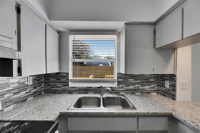 kitchen featuring sink and decorative backsplash