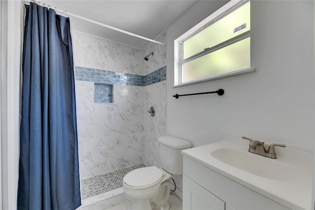 bathroom with vanity, a shower with shower curtain, and toilet