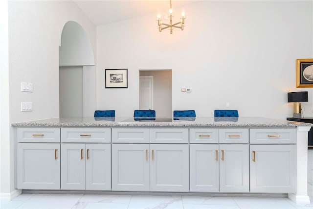 bathroom with a notable chandelier