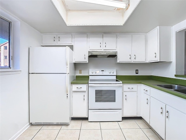 6312 Newtown Cir Unit 12A5, Tampa, FL 33615 - kitchen featuring light tile patterned floors, dark countertops, white cabinets, white appliances, and under cabinet range hood