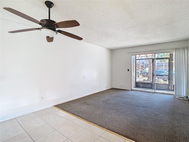 6312 Newtown Cir Unit 12A5, Tampa, FL 33615 - empty room with light colored carpet, a textured ceiling, and baseboards