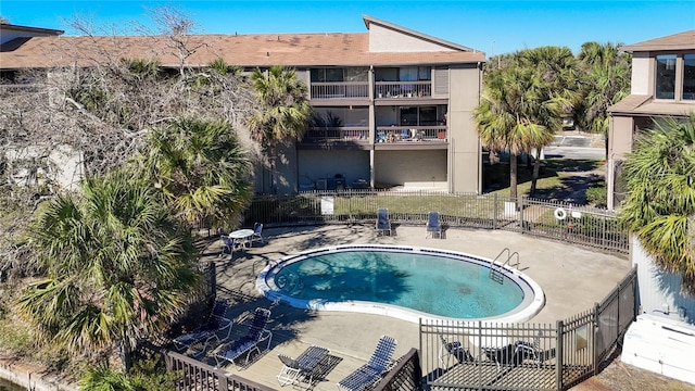 6312 Newtown Cir Unit 12A5, Tampa, FL 33615 - community pool with a patio area and fence