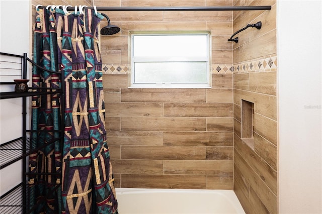 bathroom featuring shower / tub combo with curtain