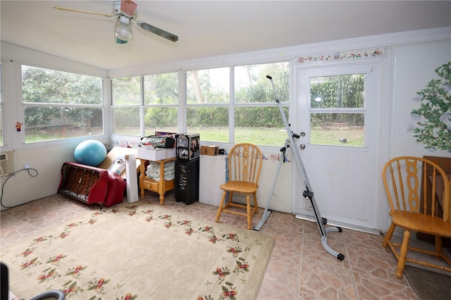 sunroom / solarium with plenty of natural light and a ceiling fan