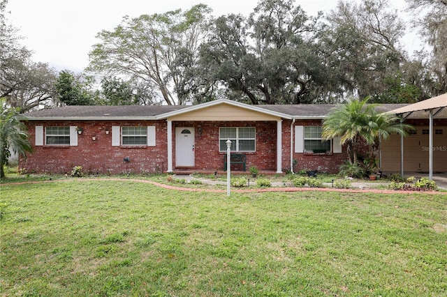 ranch-style house featuring a garage, a front yard, and brick siding