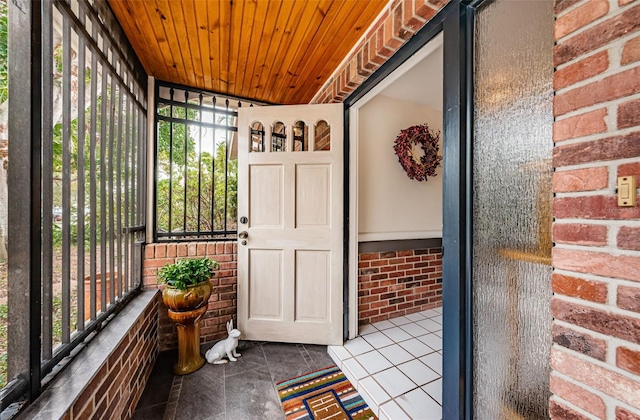 sunroom / solarium with wood ceiling