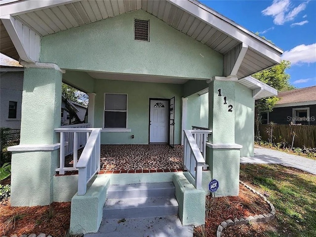 property entrance featuring covered porch