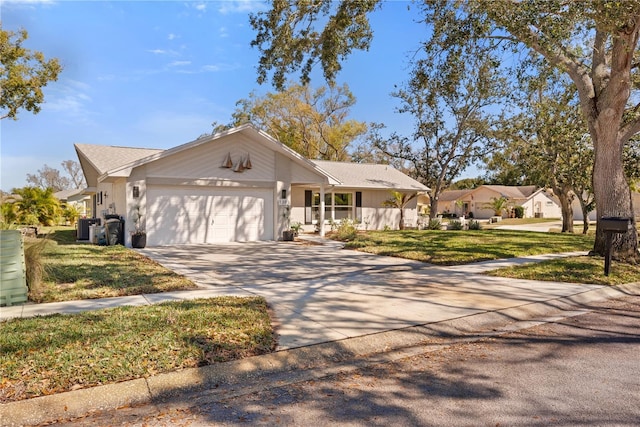 ranch-style home featuring driveway, a residential view, an attached garage, central air condition unit, and a front yard