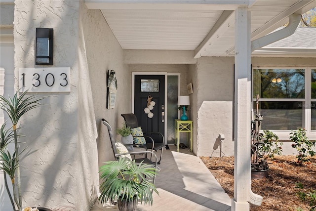 property entrance featuring stucco siding