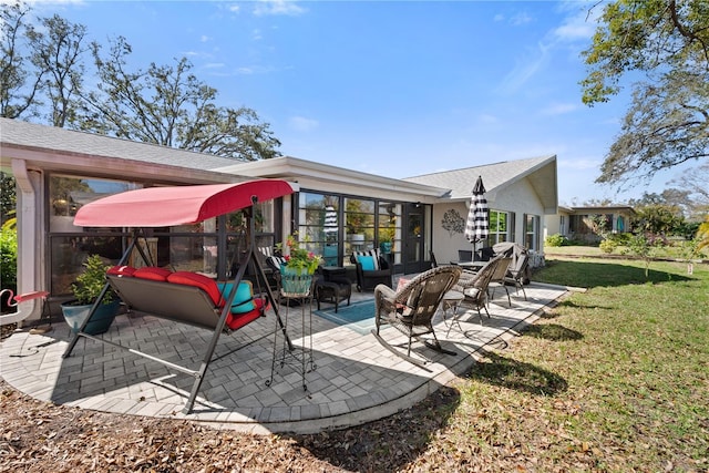 exterior space with a patio area, a yard, and outdoor lounge area