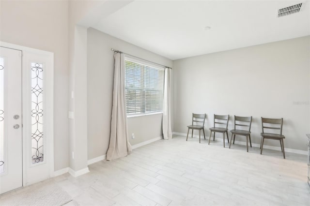 interior space with visible vents and baseboards