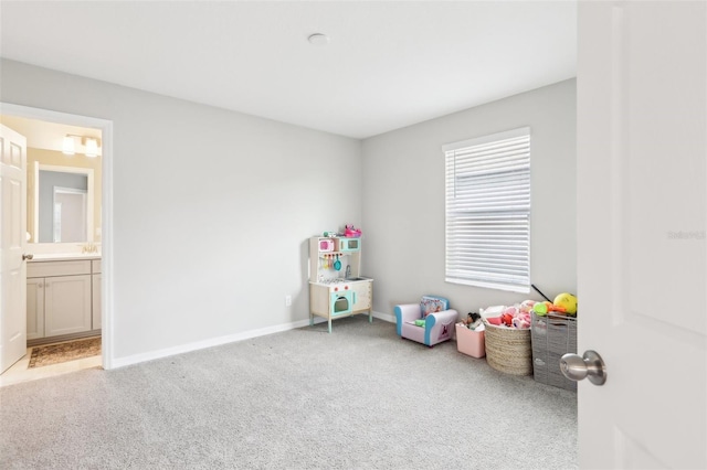 game room with carpet floors and baseboards