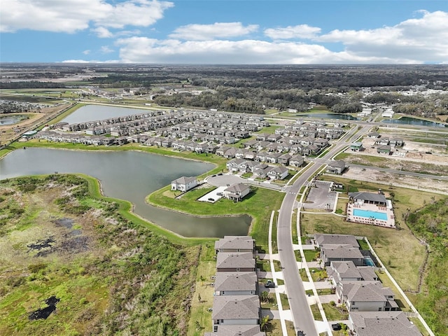 bird's eye view with a residential view and a water view