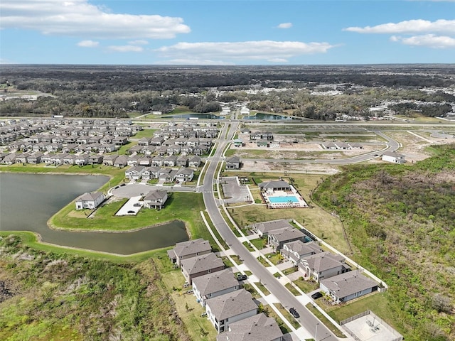 bird's eye view with a water view and a residential view