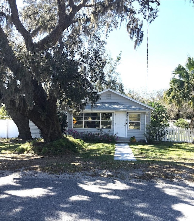 view of front of house with entry steps and fence